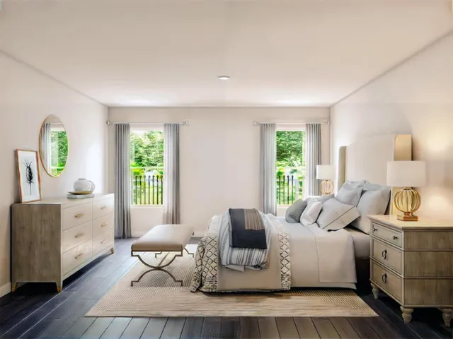 a living room with furniture a window and a table