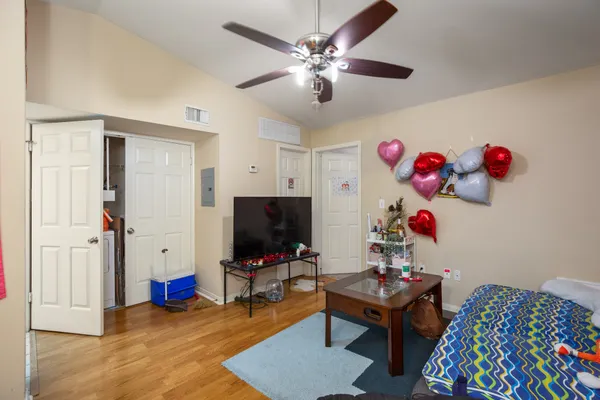 a living room with furniture and a flat screen tv