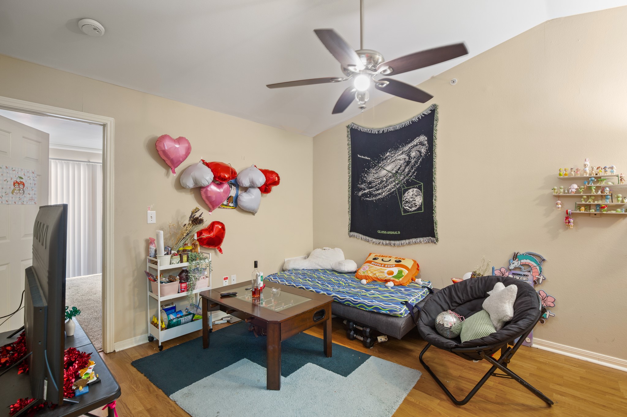 501 West 26th Street, Unit 304 Austin, TX 78705 - Photo 2 of 14 a reading room with furniture and wooden floor