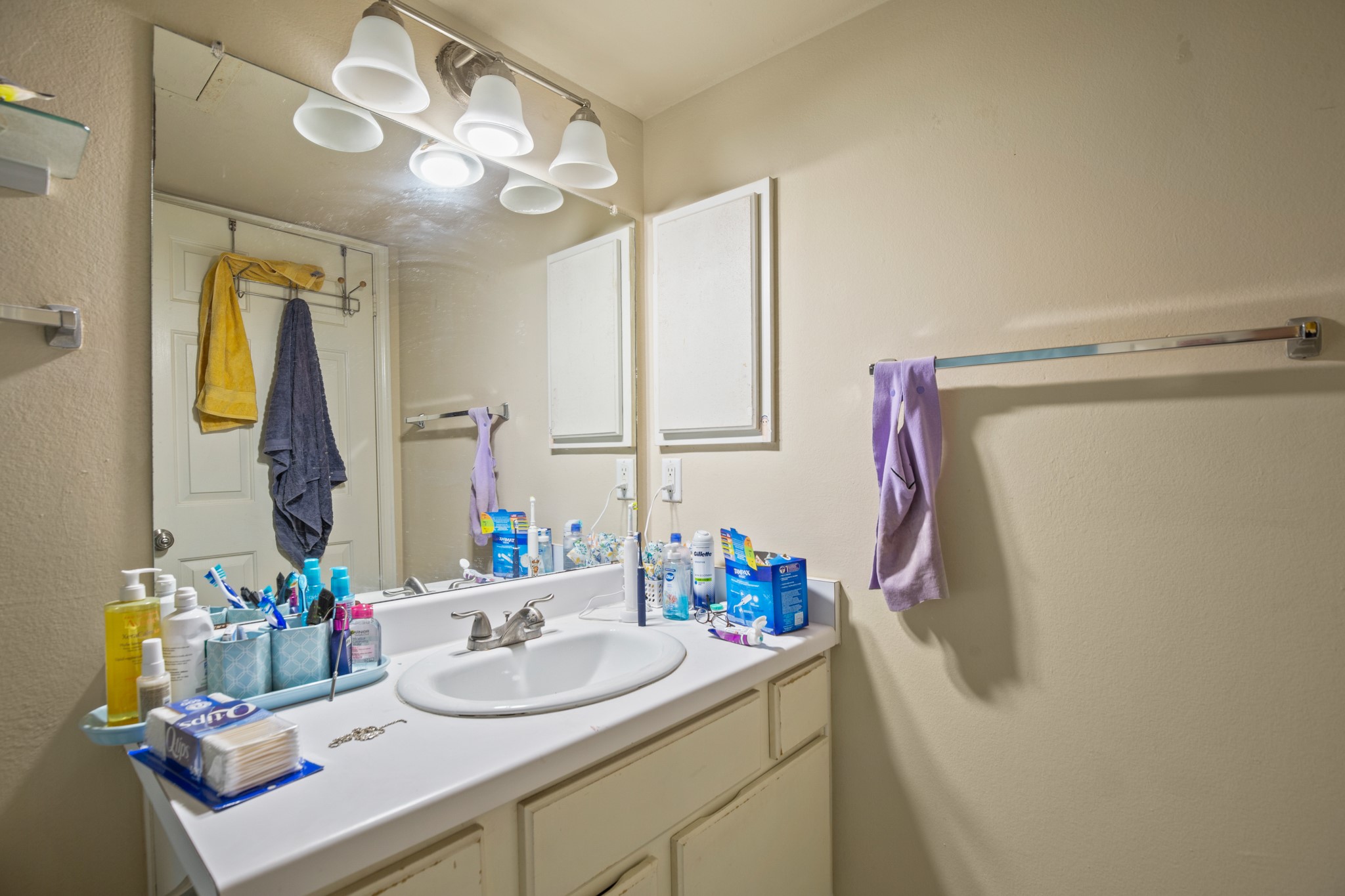 501 West 26th Street, Unit 304 Austin, TX 78705 - Photo 8 of 14 a bathroom with a sink vanity and a mirror