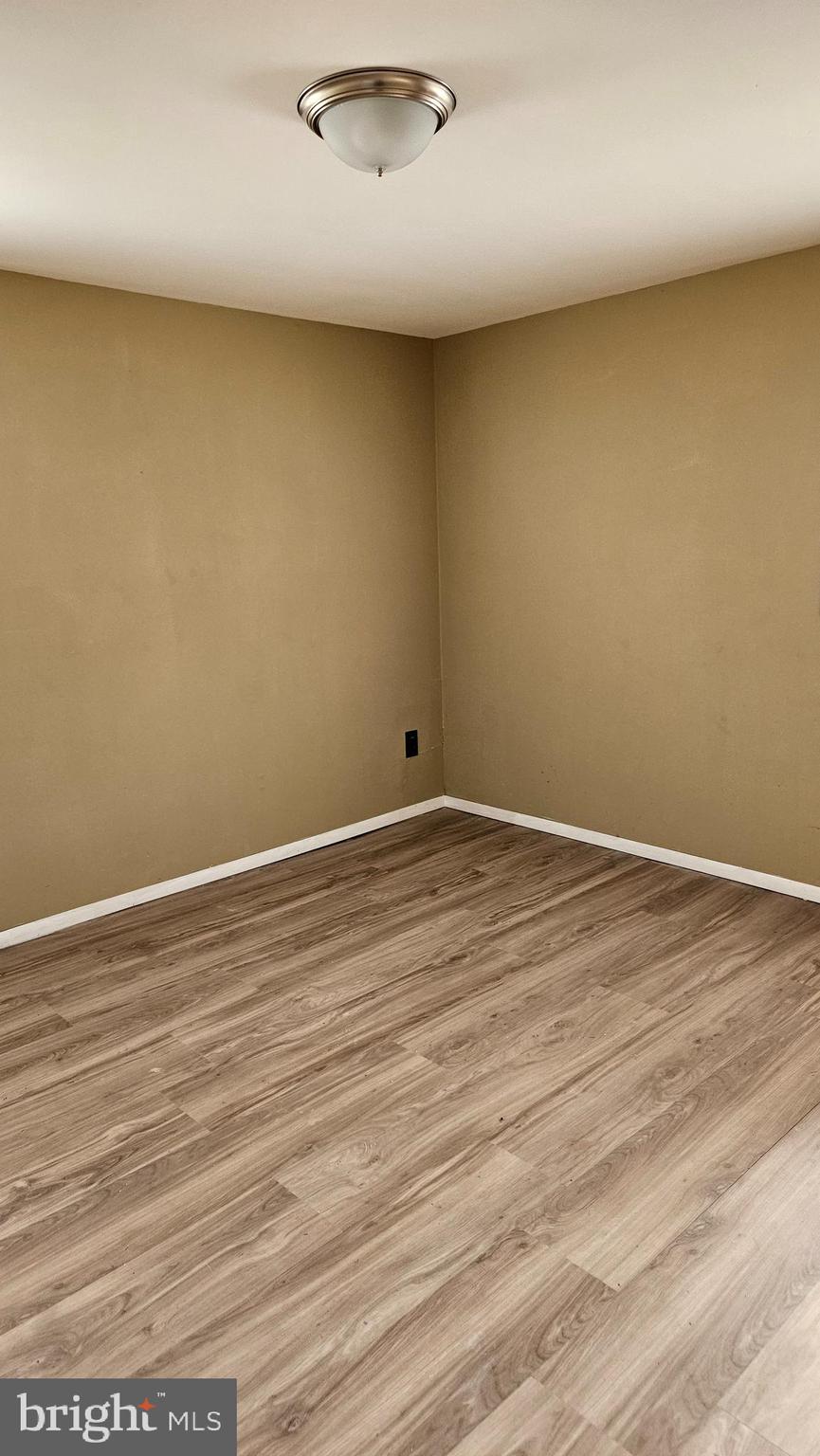 16506 Ridge Road King George, VA 22485 - Photo 5 of 15 an empty room with wooden floor