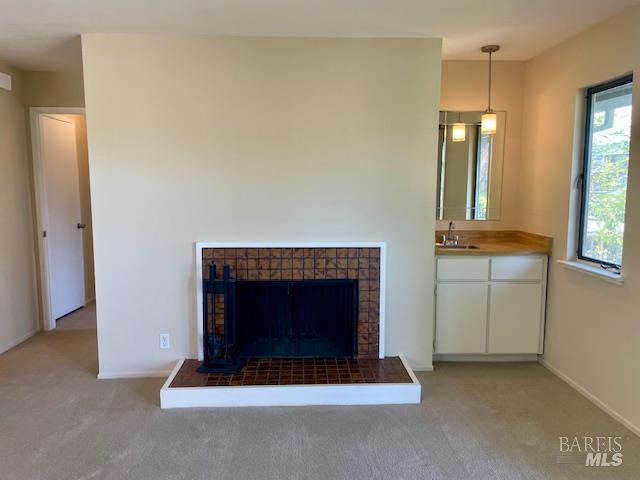 14 Scottsdale Way Novato, CA 94947 - Photo 12 of 34 a living room with furniture and a fireplace