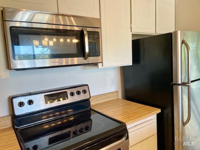14 Scottsdale Way Novato, CA 94947 - Photo 8 of 34 a kitchen with a stove and a microwave