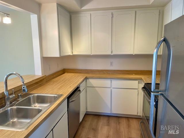 14 Scottsdale Way Novato, CA 94947 - Photo 9 of 34 a kitchen with a sink cabinets and appliances