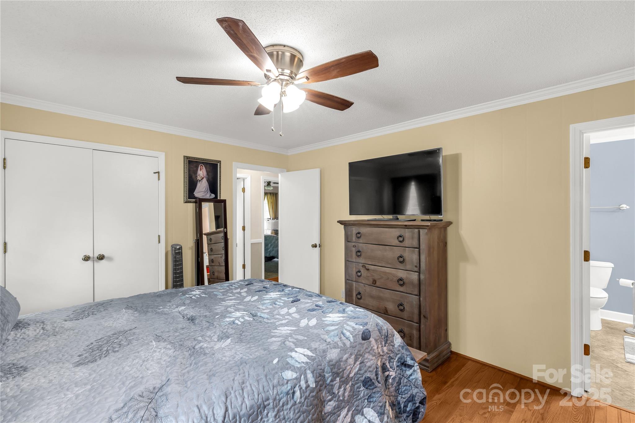 1162 East Doc Garris Road Lancaster, SC 29720 - Photo 14 of 31 a bedroom with a bed and a flat tv screen on dresser
