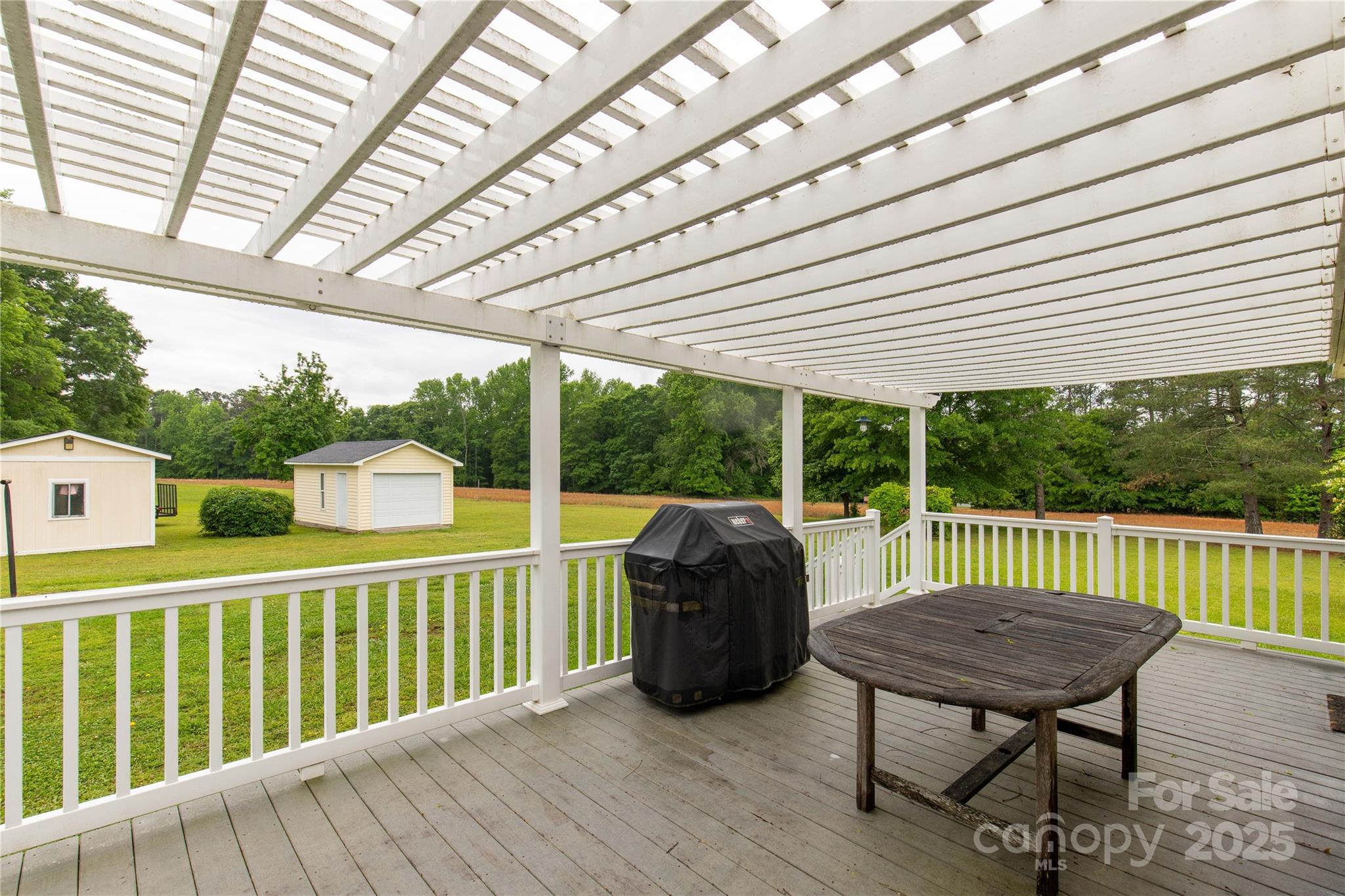 1162 East Doc Garris Road Lancaster, SC 29720 - Photo 25 of 31 a view of a chair and tables in the balcony