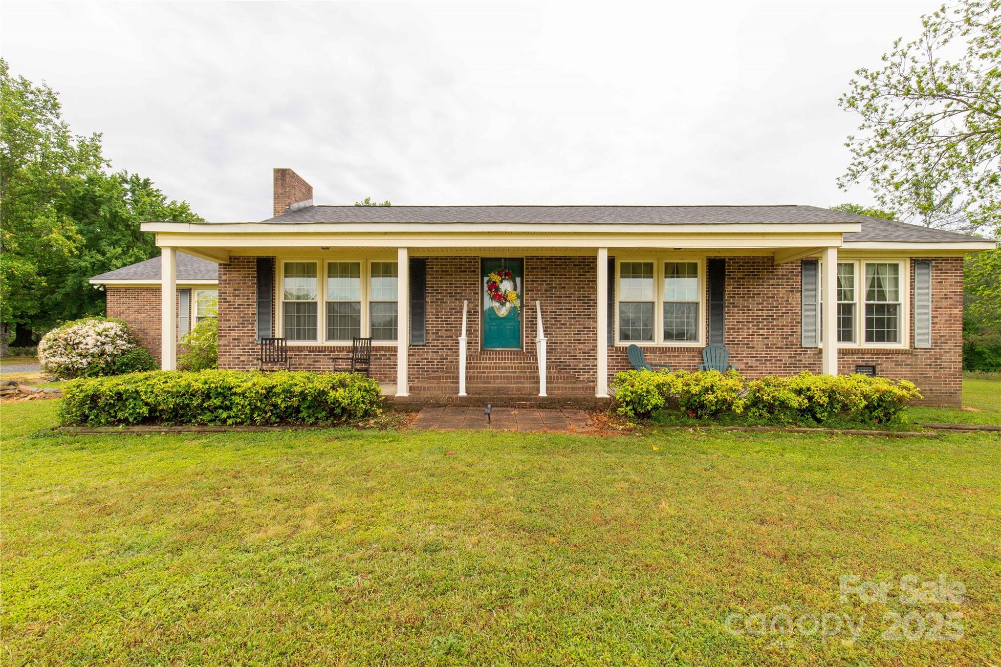 1162 East Doc Garris Road Lancaster, SC 29720 - Photo 4 of 31 front view of a house with a garden