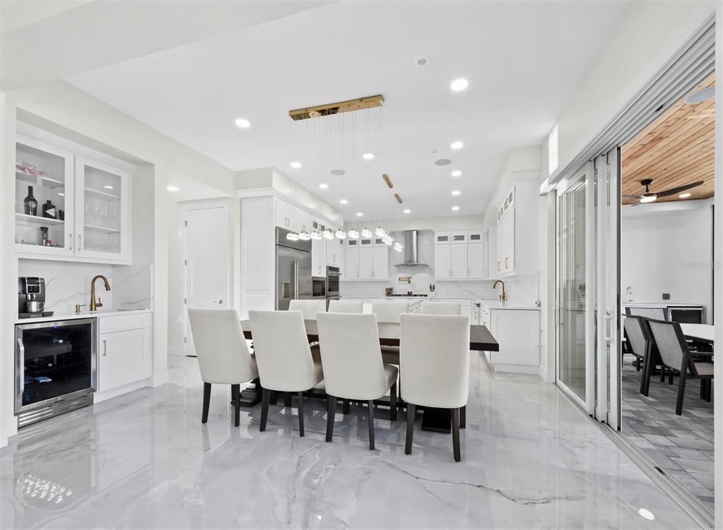 635 Jungle Queen Way Longboat Key, FL 34228 - Photo 12 of 55 a large kitchen with a table and chairs