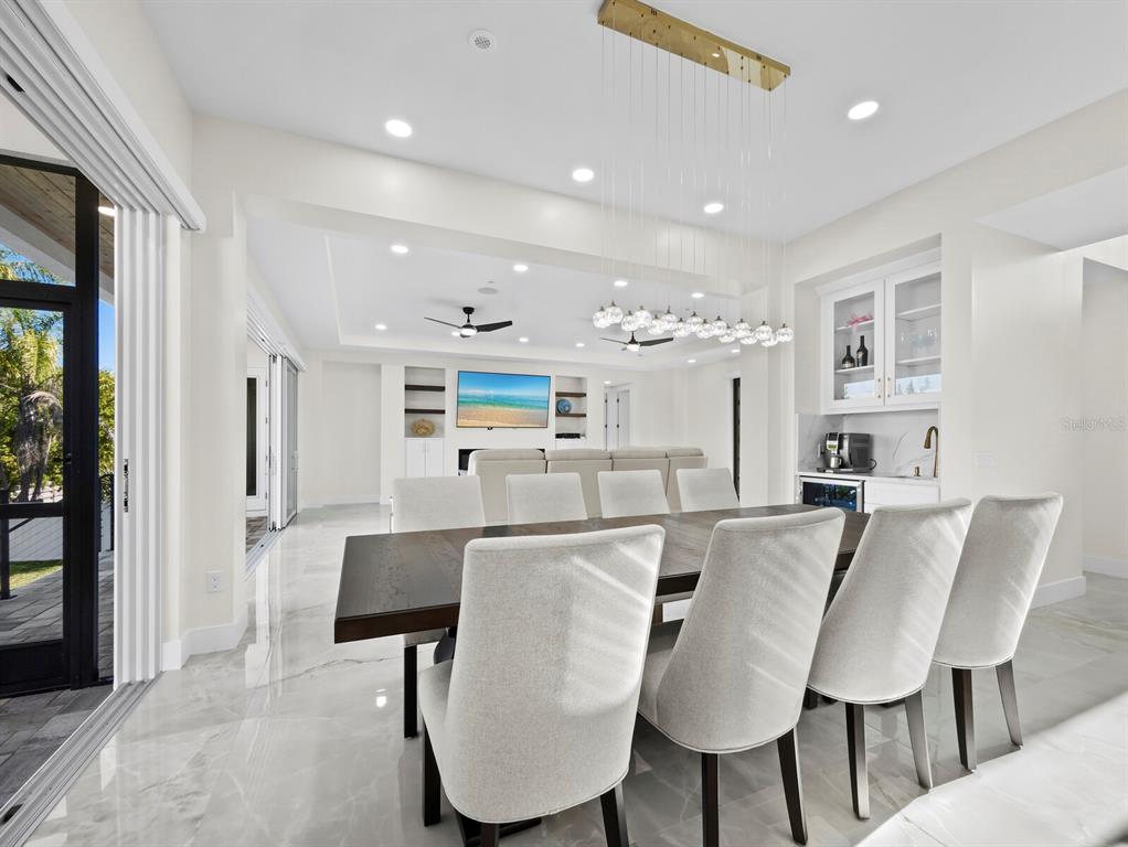 635 Jungle Queen Way Longboat Key, FL 34228 - Photo 13 of 55 a view of a dining room with furniture and wooden floor