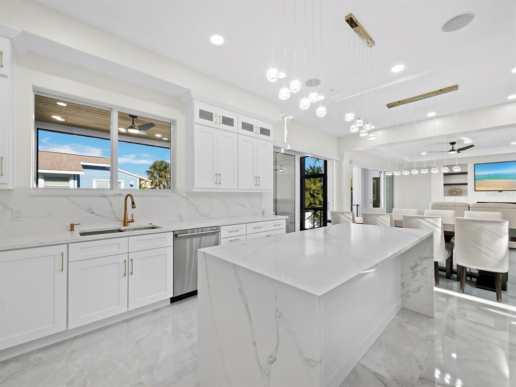 635 Jungle Queen Way Longboat Key, FL 34228 - Photo 18 of 55 a large white kitchen with a large window