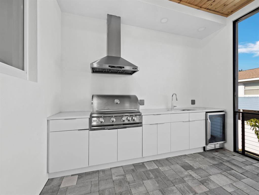 635 Jungle Queen Way Longboat Key, FL 34228 - Photo 20 of 55 a kitchen with a stove and cabinets
