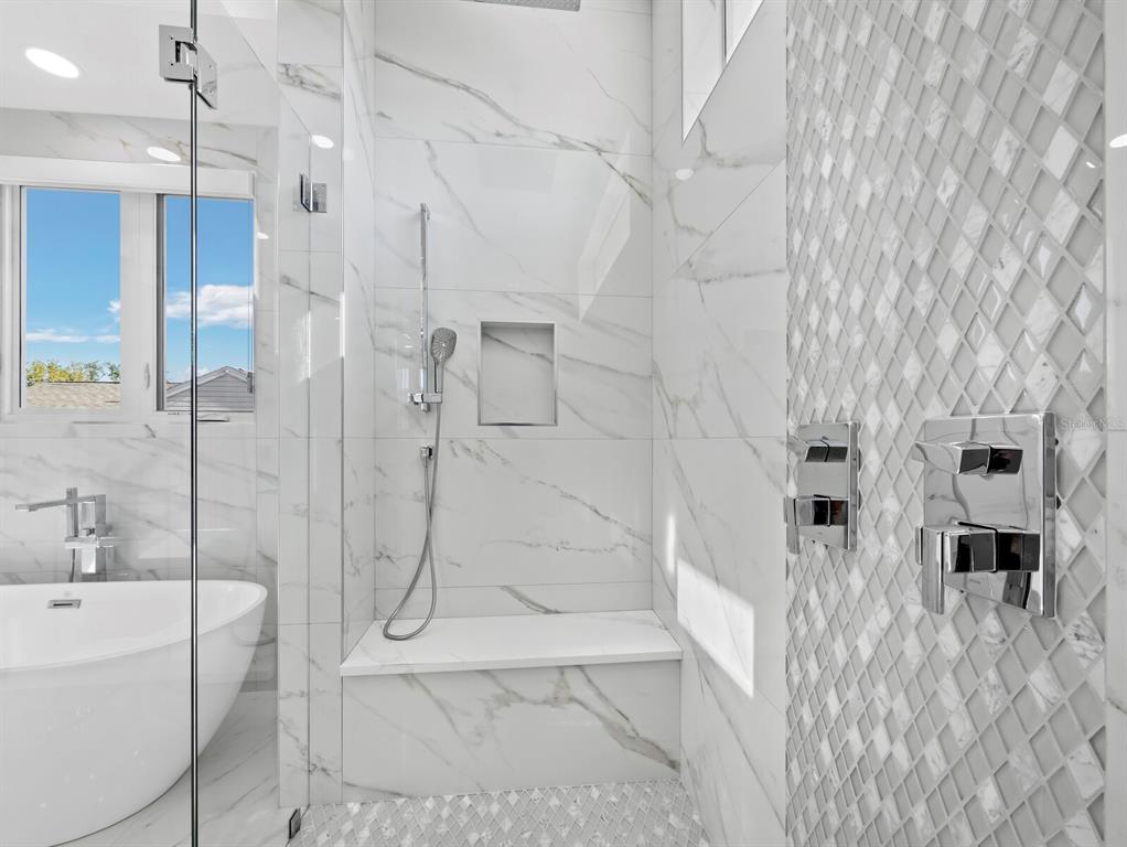 635 Jungle Queen Way Longboat Key, FL 34228 - Photo 27 of 55 a bathroom with shower