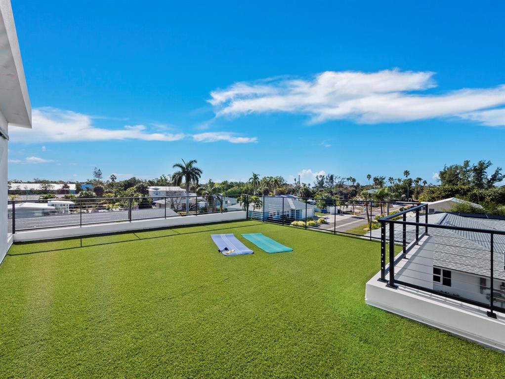 635 Jungle Queen Way Longboat Key, FL 34228 - Photo 31 of 55 a view of a swimming pool with lounge chair