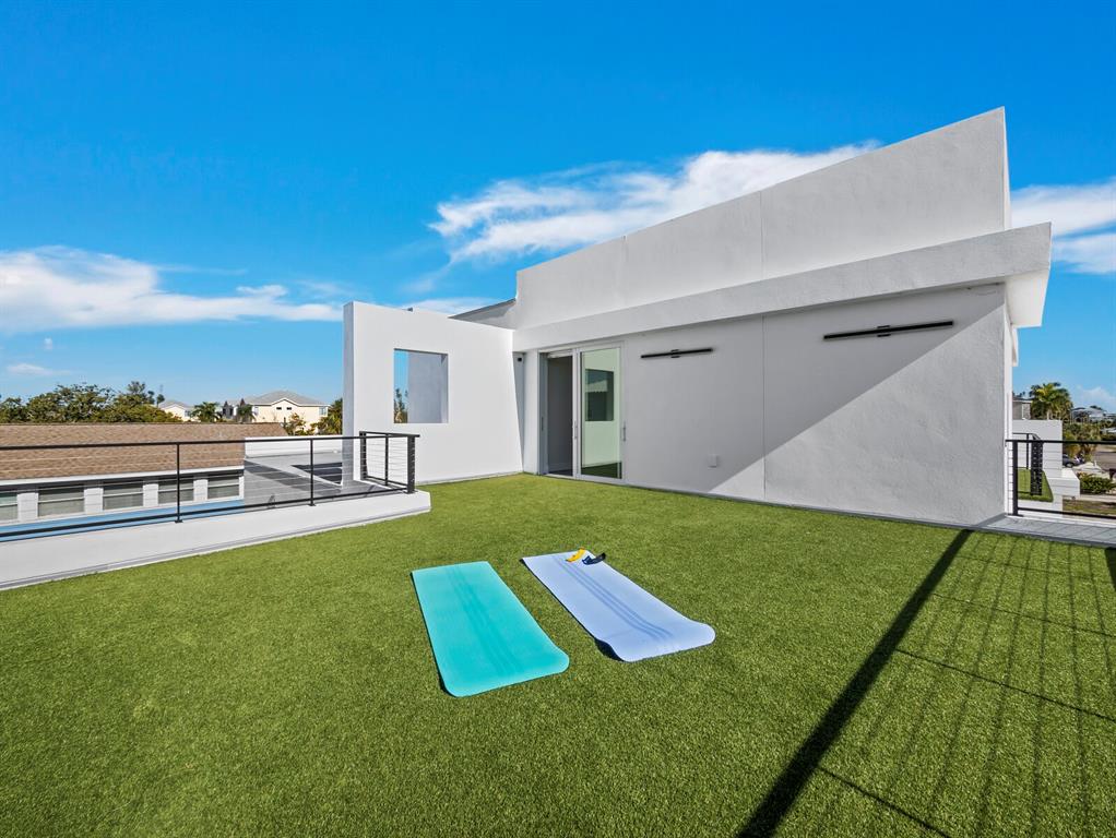 635 Jungle Queen Way Longboat Key, FL 34228 - Photo 33 of 55 a view of a backyard with swimming pool