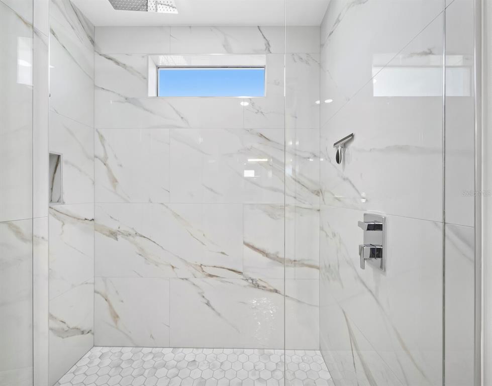 635 Jungle Queen Way Longboat Key, FL 34228 - Photo 36 of 55 a bathroom with a shower