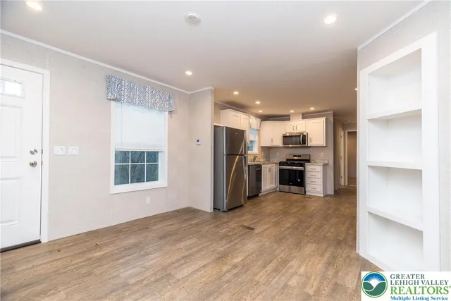 a view of kitchen with stainless steel appliances refrigerator oven