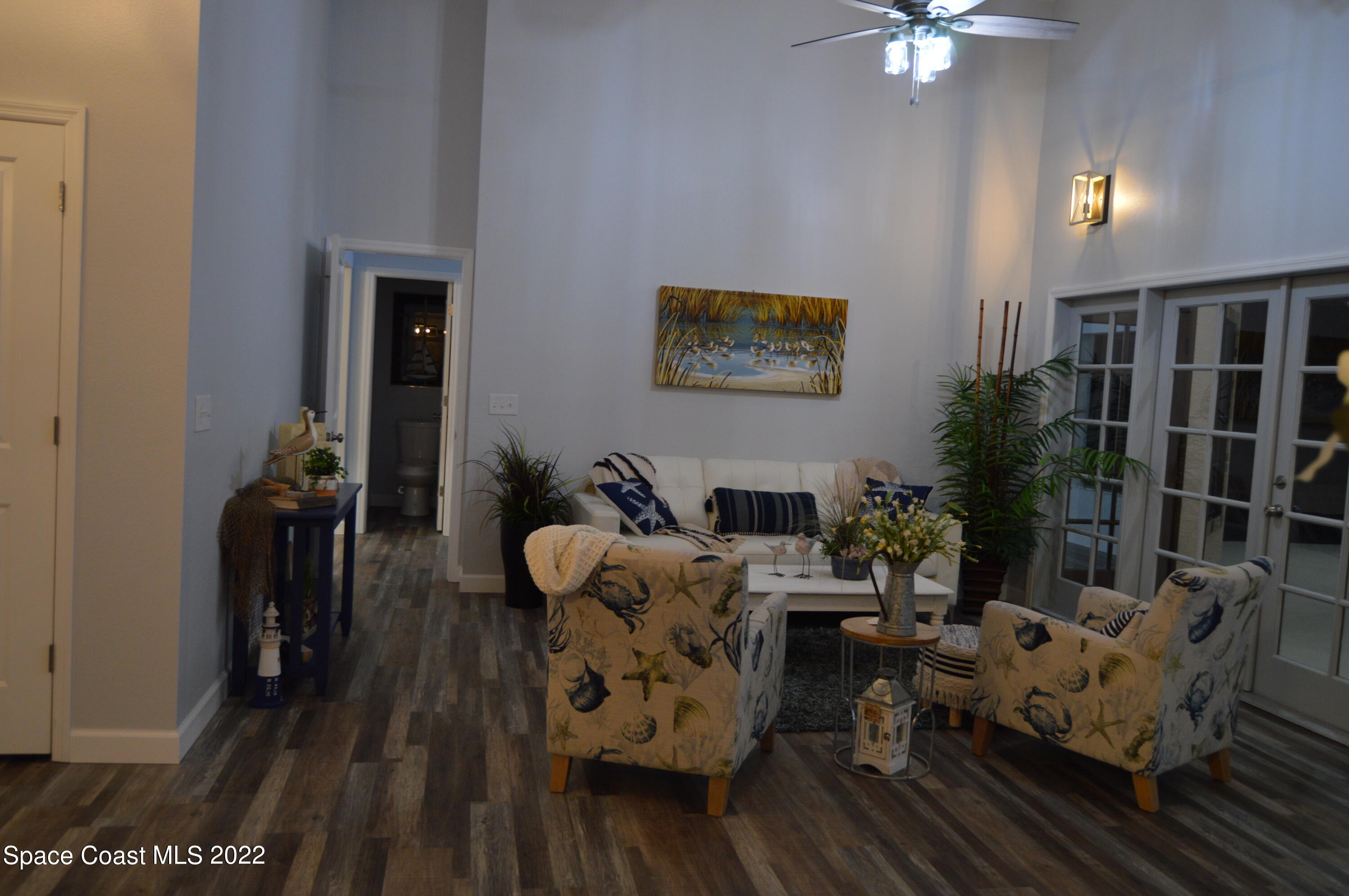 3460 Carter Road Mims, FL 32754 - Photo 14 of 32 a living room with furniture and wooden floor