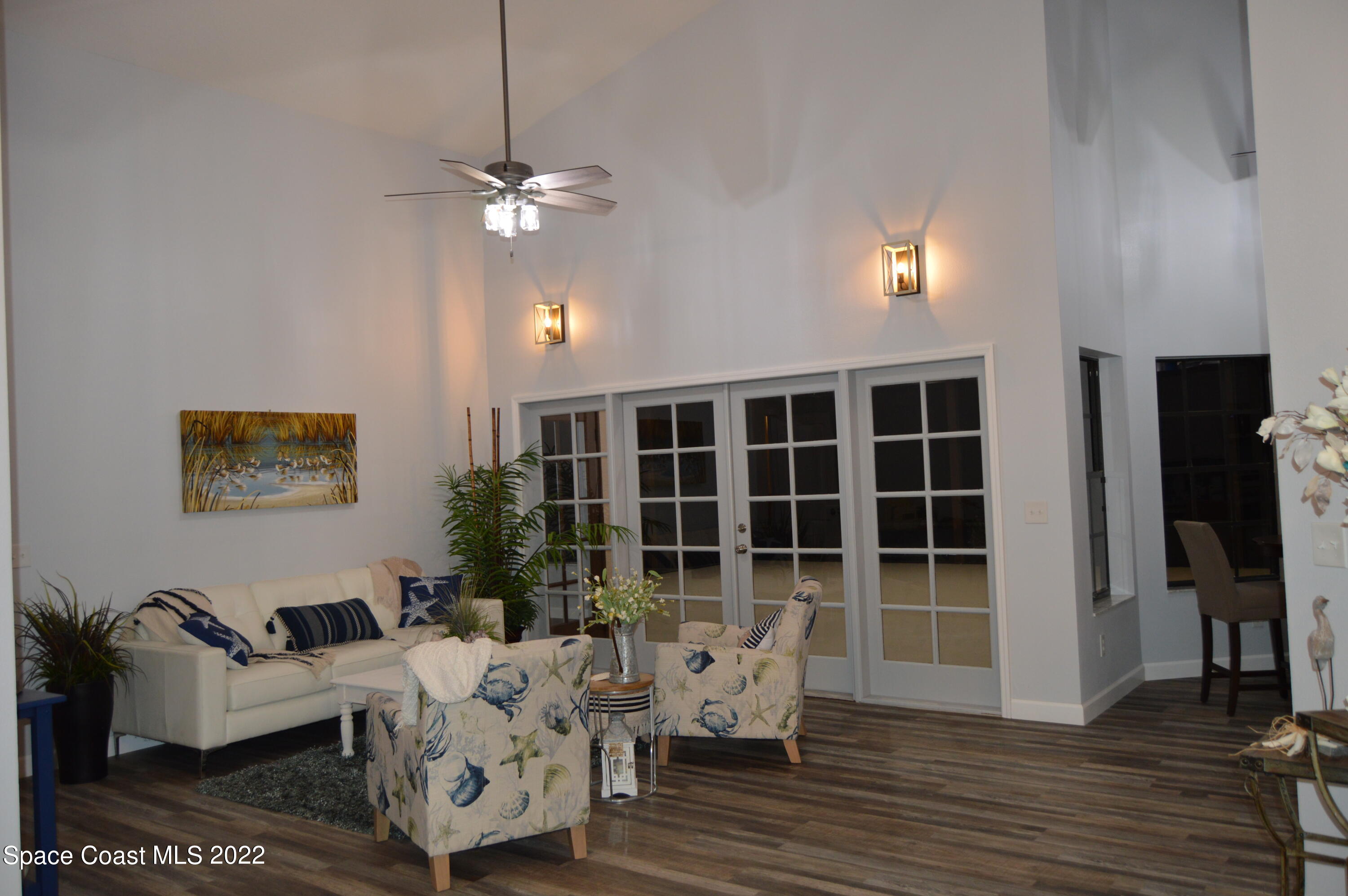 3460 Carter Road Mims, FL 32754 - Photo 15 of 32 a living room with furniture a lamp and a window