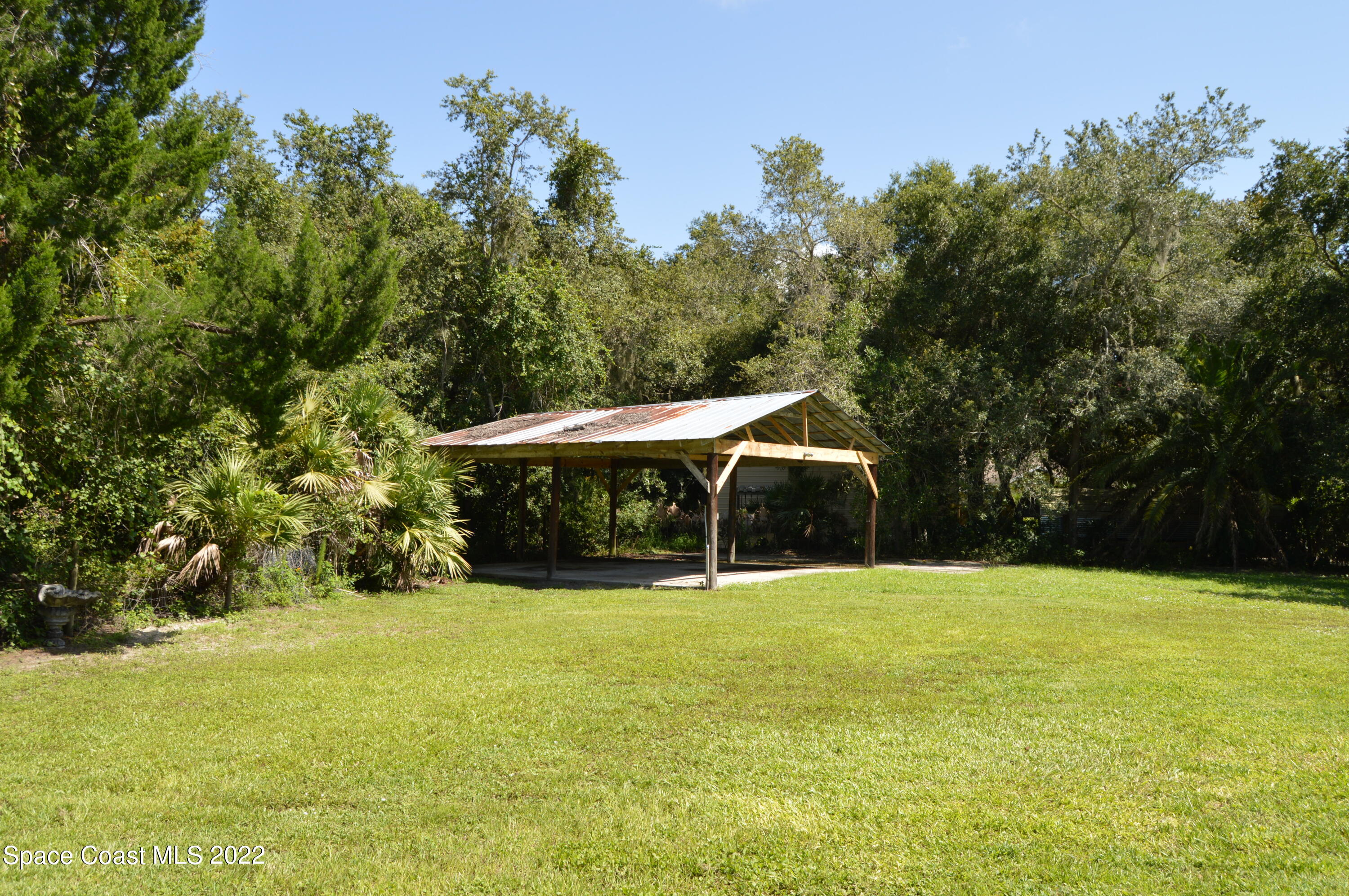 3460 Carter Road Mims, FL 32754 - Photo 18 of 32 a view of patio with tree s