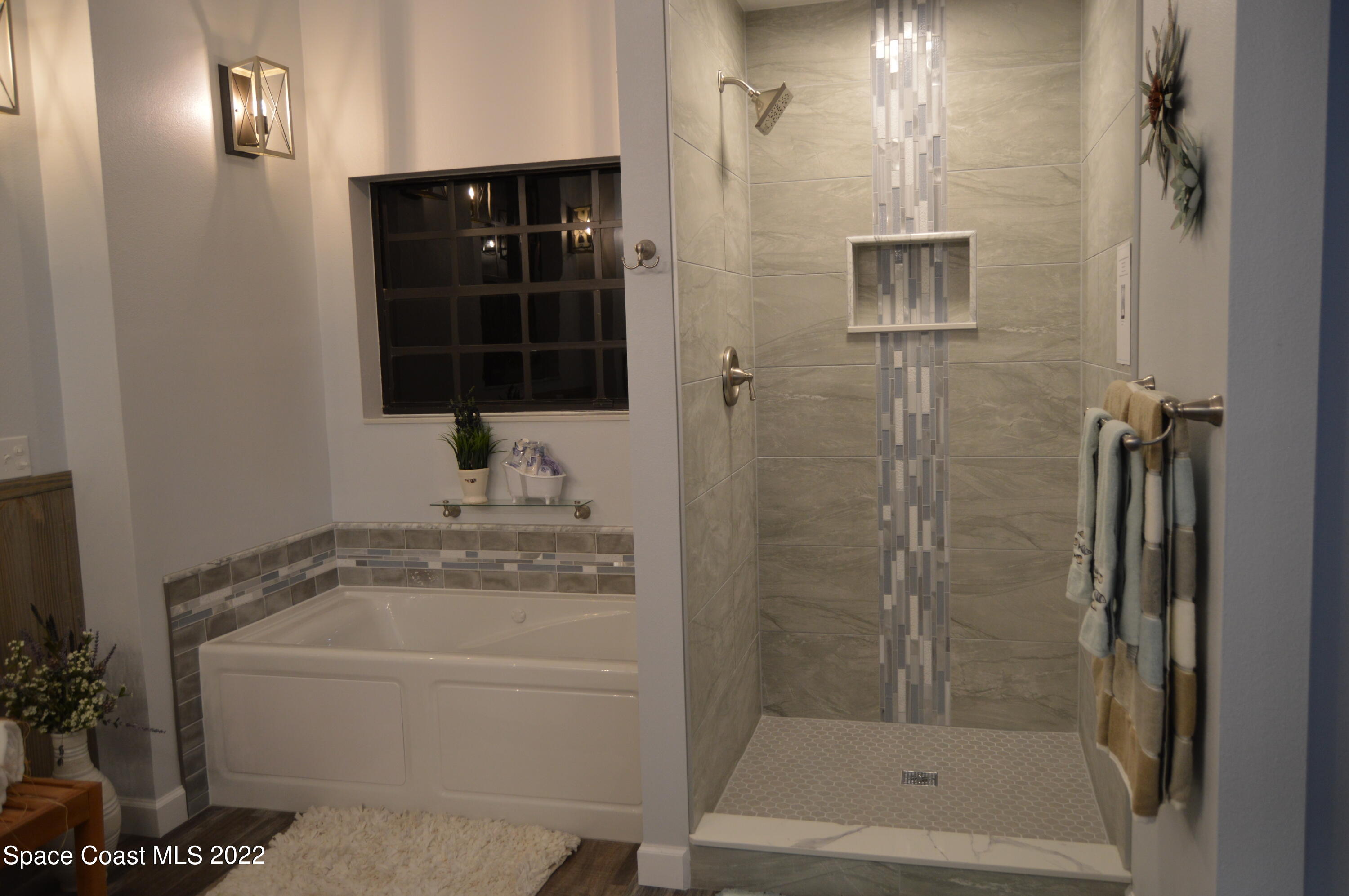 3460 Carter Road Mims, FL 32754 - Photo 30 of 32 a bathroom with a granite countertop sink a mirror and shower