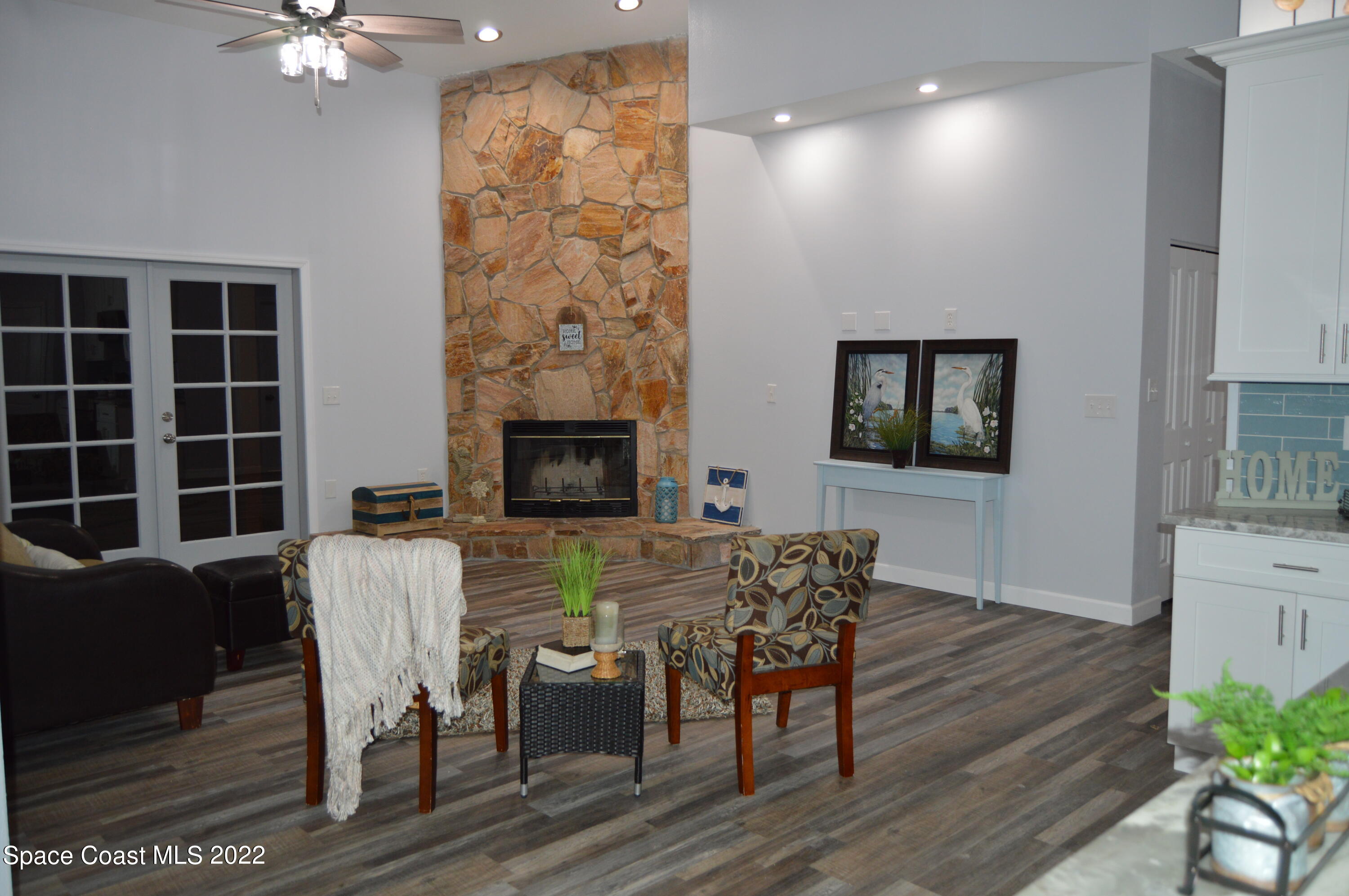 3460 Carter Road Mims, FL 32754 - Photo 8 of 32 a view of a livingroom with furniture and a flat screen tv