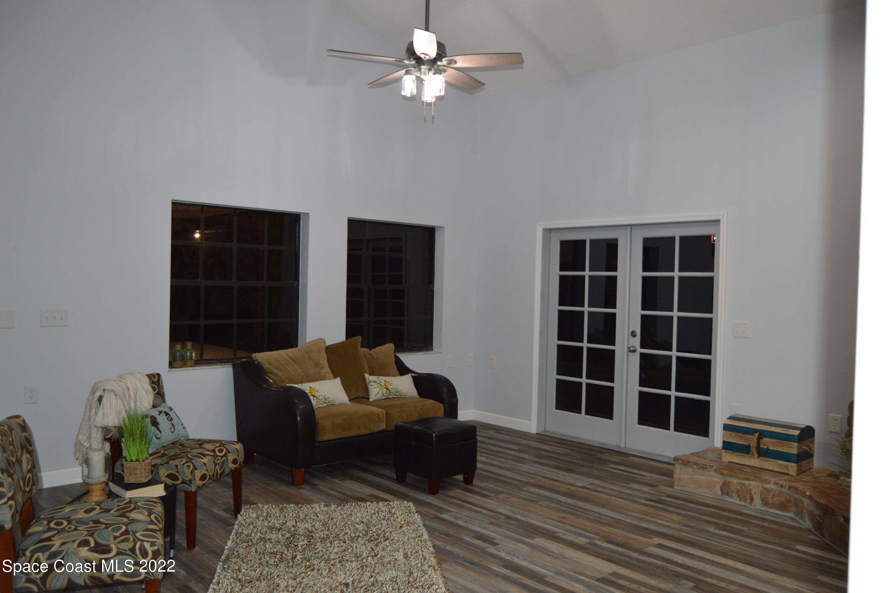 3460 Carter Road Mims, FL 32754 - Photo 9 of 32 a living room with furniture hardwood floor and a ceiling fan
