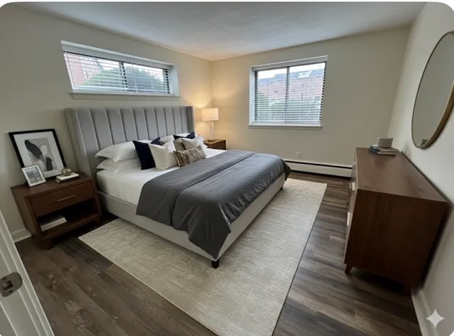 a bedroom with bed and window