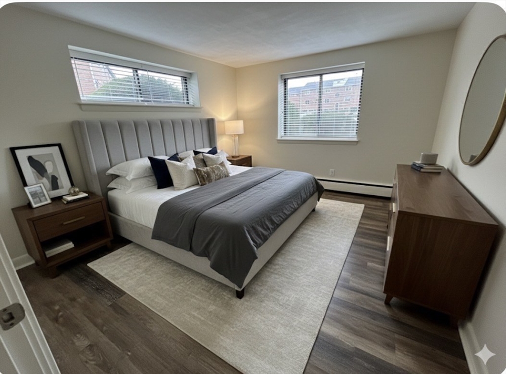 70 C Charles River Road, Unit 70C Waltham, MA 02453 - Photo 8 of 27 a bedroom with bed and window