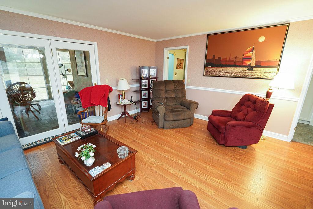30332 Dagsboro Road Salisbury, MD 21804 - Photo 12 of 53 a living room with furniture and a flat screen tv