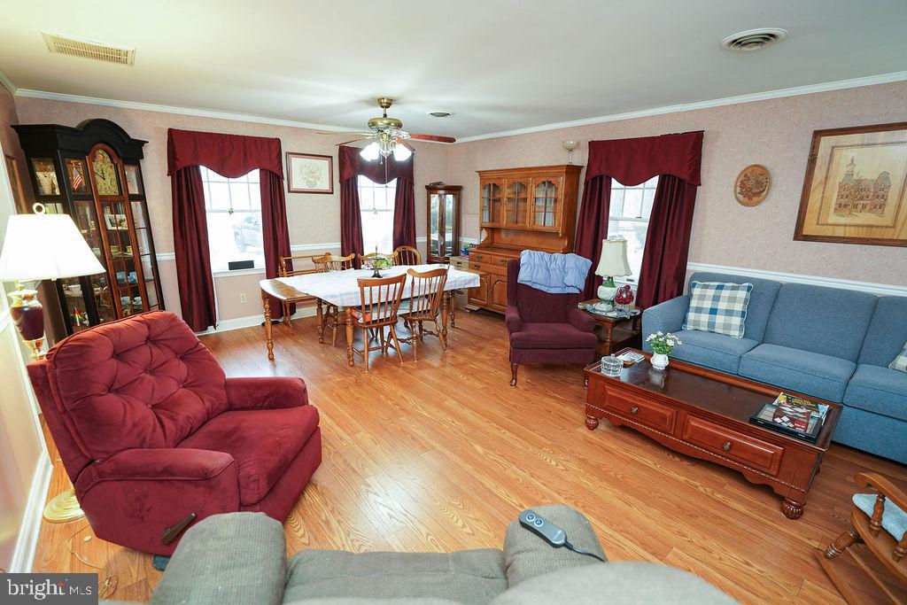 30332 Dagsboro Road Salisbury, MD 21804 - Photo 17 of 53 a living room with furniture fireplace and a large window