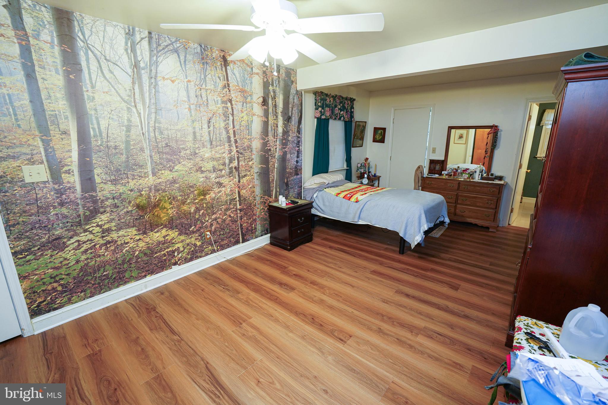 30332 Dagsboro Road Salisbury, MD 21804 - Photo 23 of 53 a bedroom with a bed and wooden floor