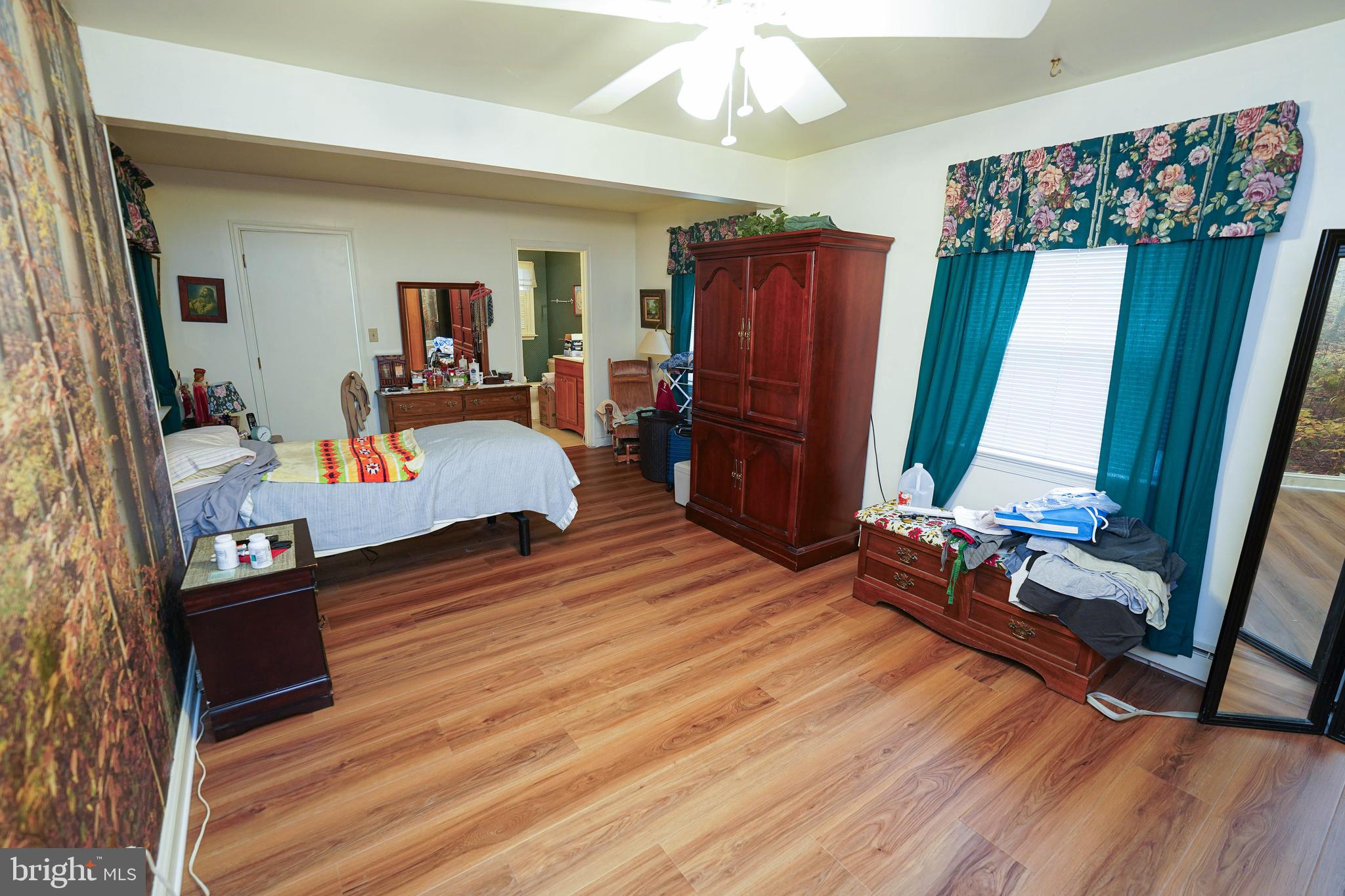 30332 Dagsboro Road Salisbury, MD 21804 - Photo 25 of 53 a living room with furniture and a wooden floor