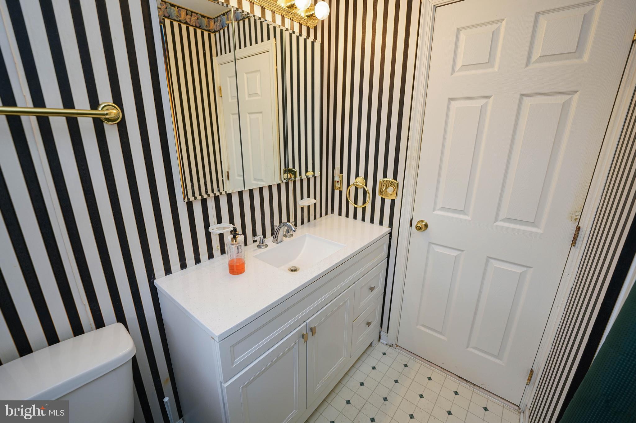 30332 Dagsboro Road Salisbury, MD 21804 - Photo 37 of 53 a bathroom with a sink a toilet and shower