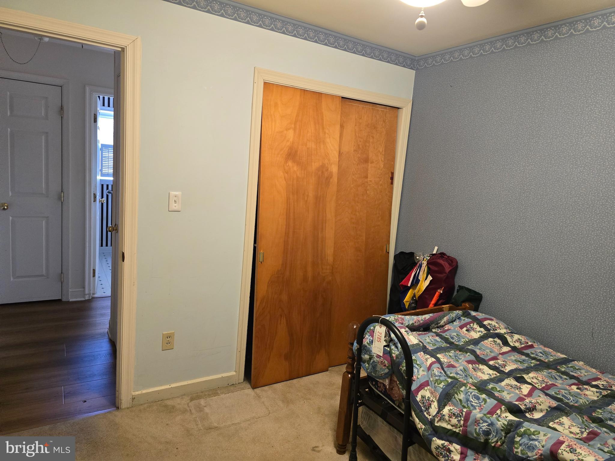 30332 Dagsboro Road Salisbury, MD 21804 - Photo 42 of 53 a bedroom with a bed and wooden floor