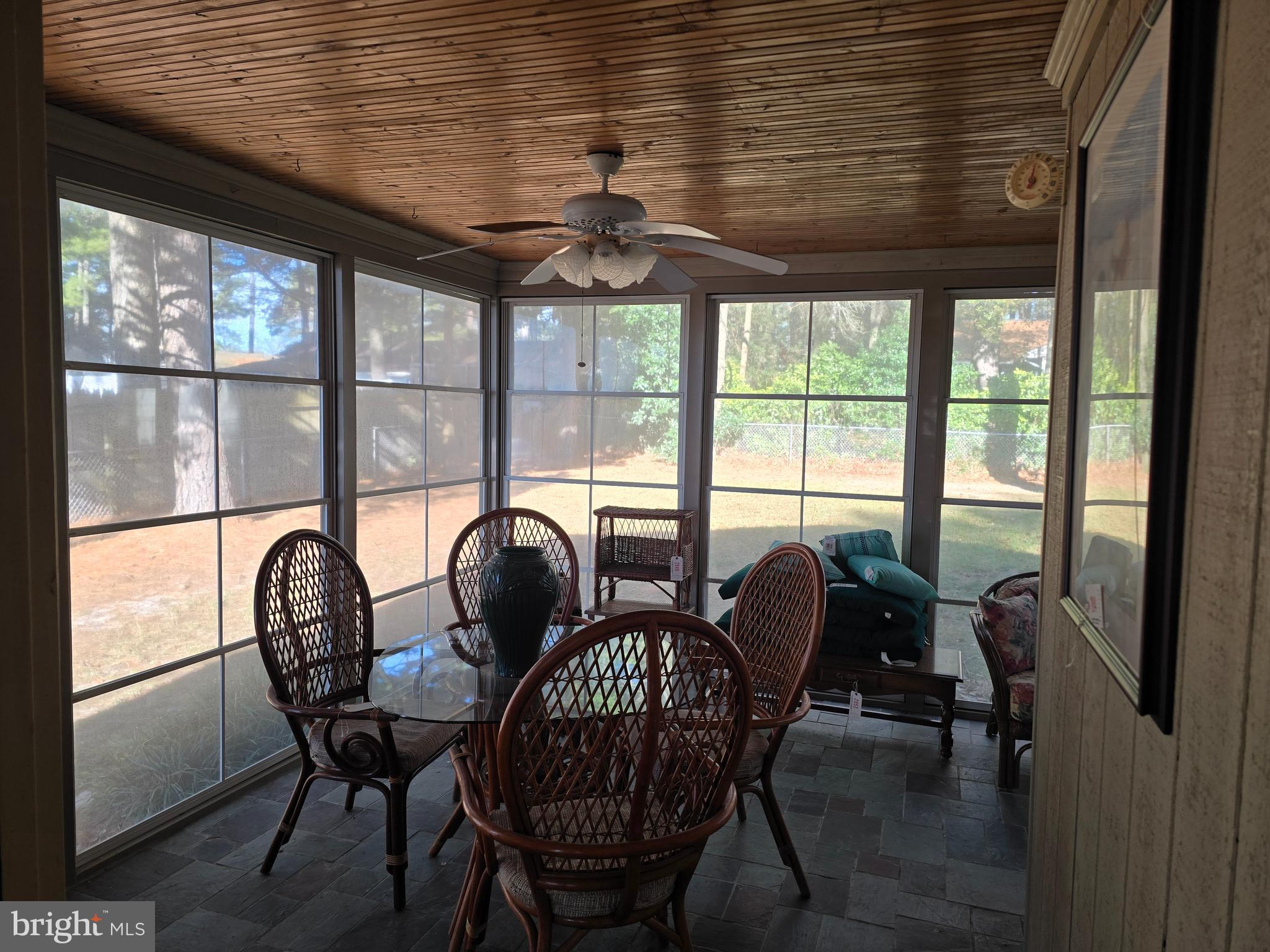 30332 Dagsboro Road Salisbury, MD 21804 - Photo 47 of 53 a dining room with furniture a chandelier and wooden floor