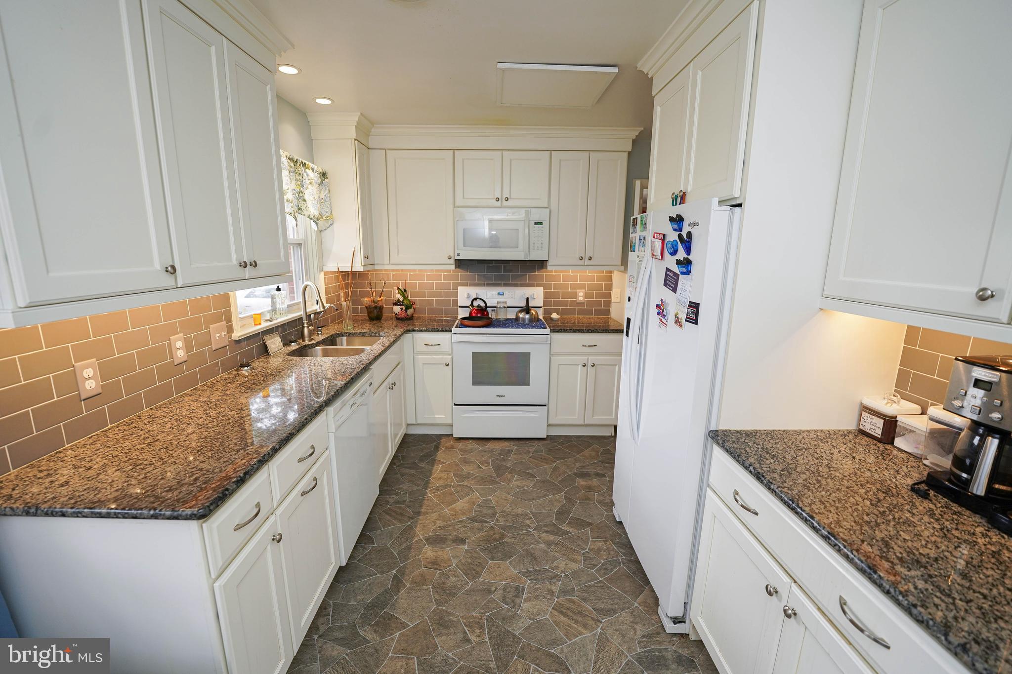 30332 Dagsboro Road Salisbury, MD 21804 - Photo 5 of 53 a large kitchen with a stove and a refrigerator