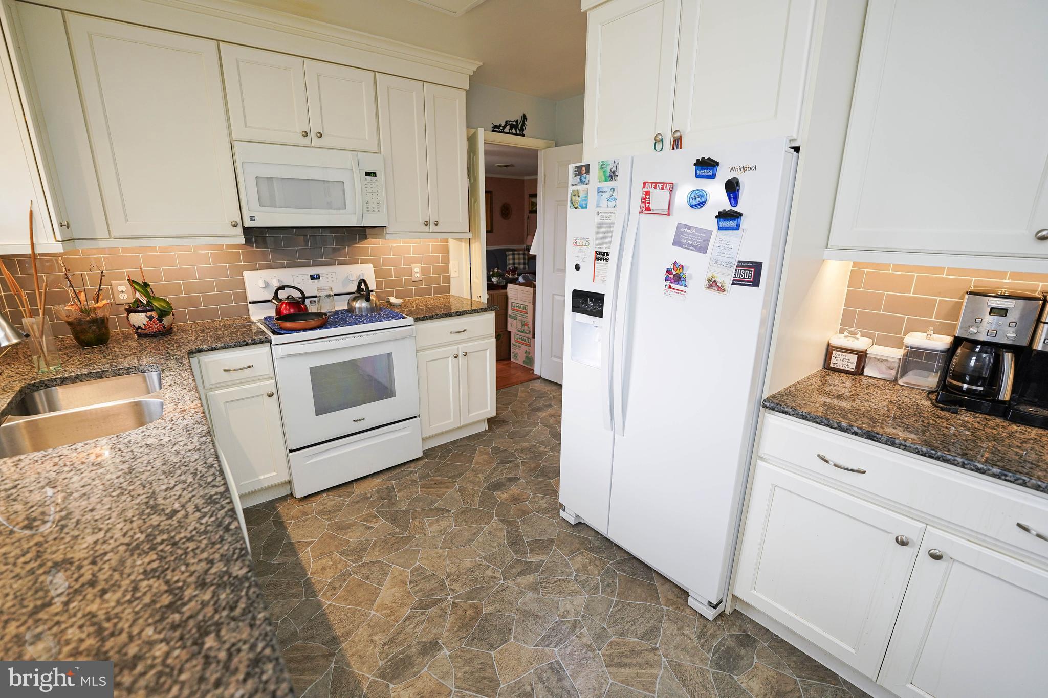 30332 Dagsboro Road Salisbury, MD 21804 - Photo 7 of 53 a kitchen with stainless steel appliances a refrigerator sink and cabinets