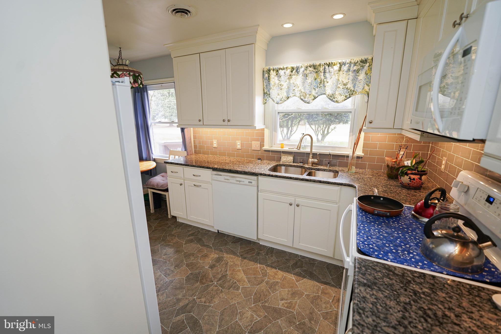 30332 Dagsboro Road Salisbury, MD 21804 - Photo 8 of 53 a kitchen with a sink appliances and cabinets