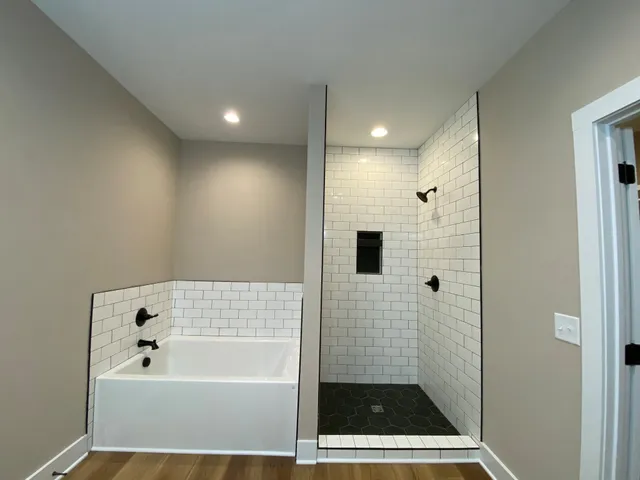 a spacious bathroom with a granite countertop sink and a mirror