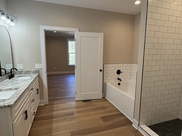a kitchen with a stove and a white cabinet