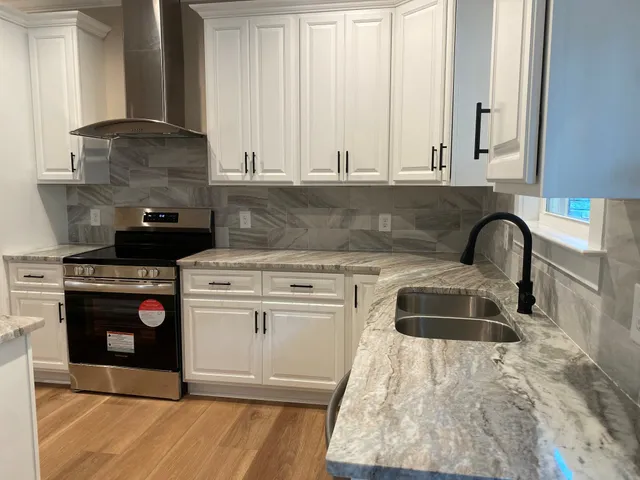 a view of an empty room with a ceiling fan and window