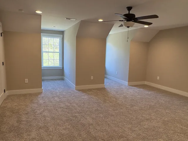 a view of a porch with a table and chairs