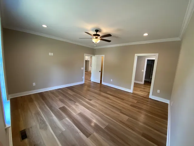 a spacious bathroom with a double vanity sink and a mirror