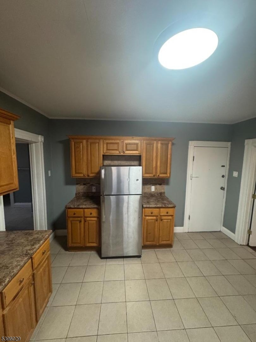 117 Mechanic Street, Unit 6 Boonton, NJ 07005 - Photo 3 of 8 a kitchen with a refrigerator and a stove