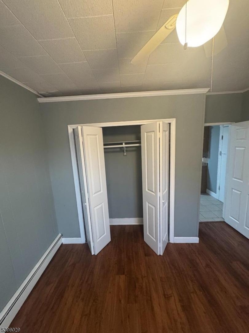 117 Mechanic Street, Unit 6 Boonton, NJ 07005 - Photo 6 of 8 an empty room with wooden floor and windows