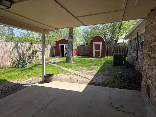 a brick house with a yard