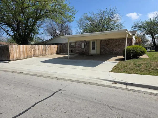 a view of a house with a street