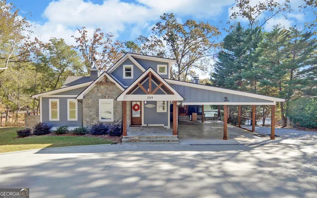 a view of a hallway with closet and wooden floor