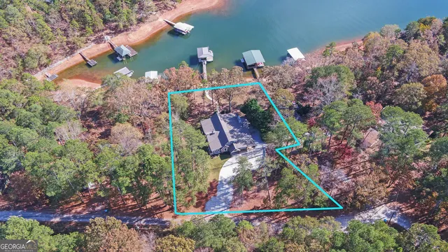 a kitchen with stainless steel appliances granite countertop a stove and a wooden floors