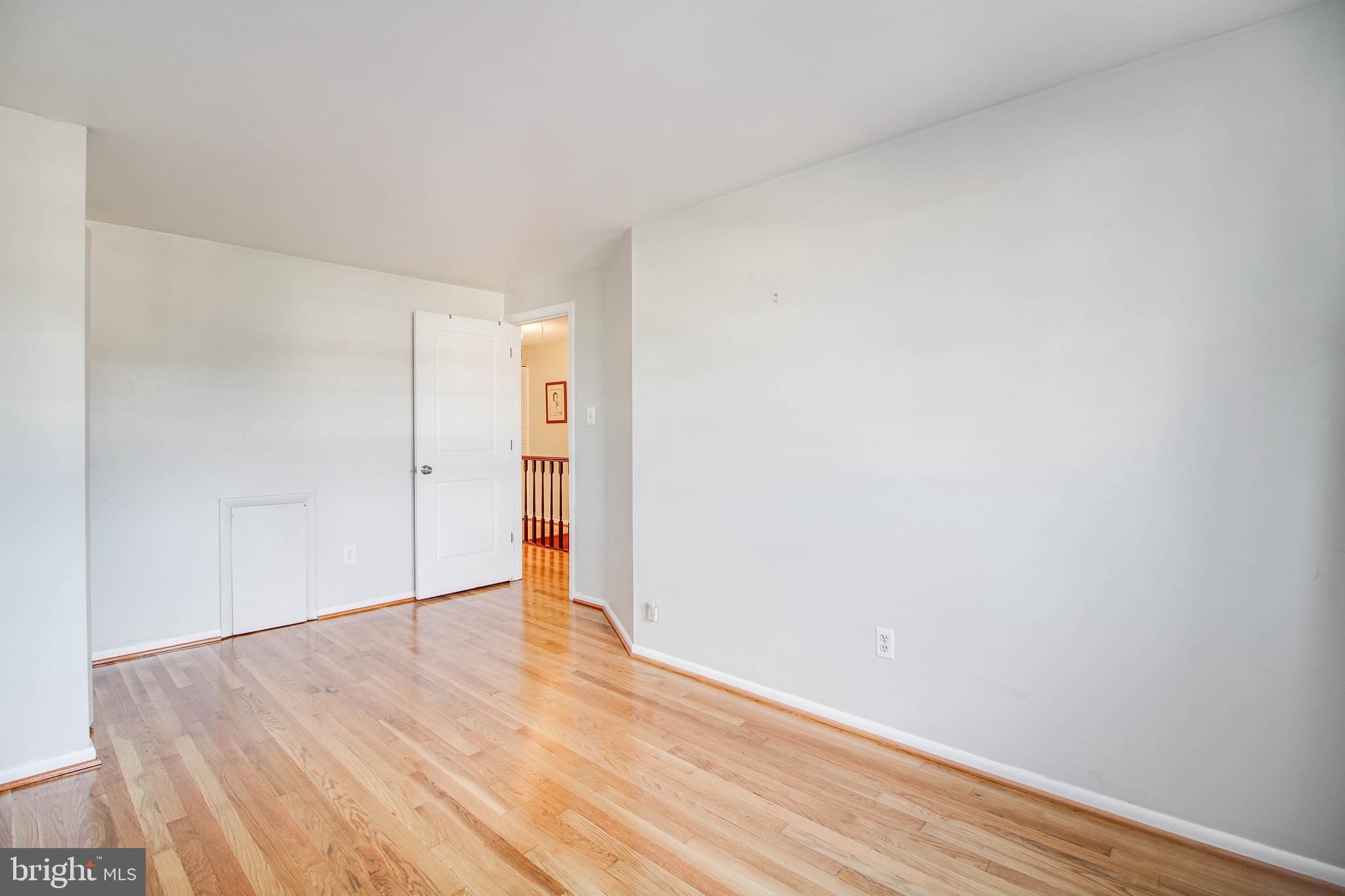 5649 Chelwynd Road Halethorpe, MD 21227 - Photo 21 of 44 a view of an empty room with wooden floor